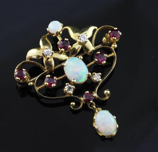 A 1970s Art Nouveau style 18ct gold, white opal, ruby and diamond set open scrollwork pendant brooch, 1.5in.